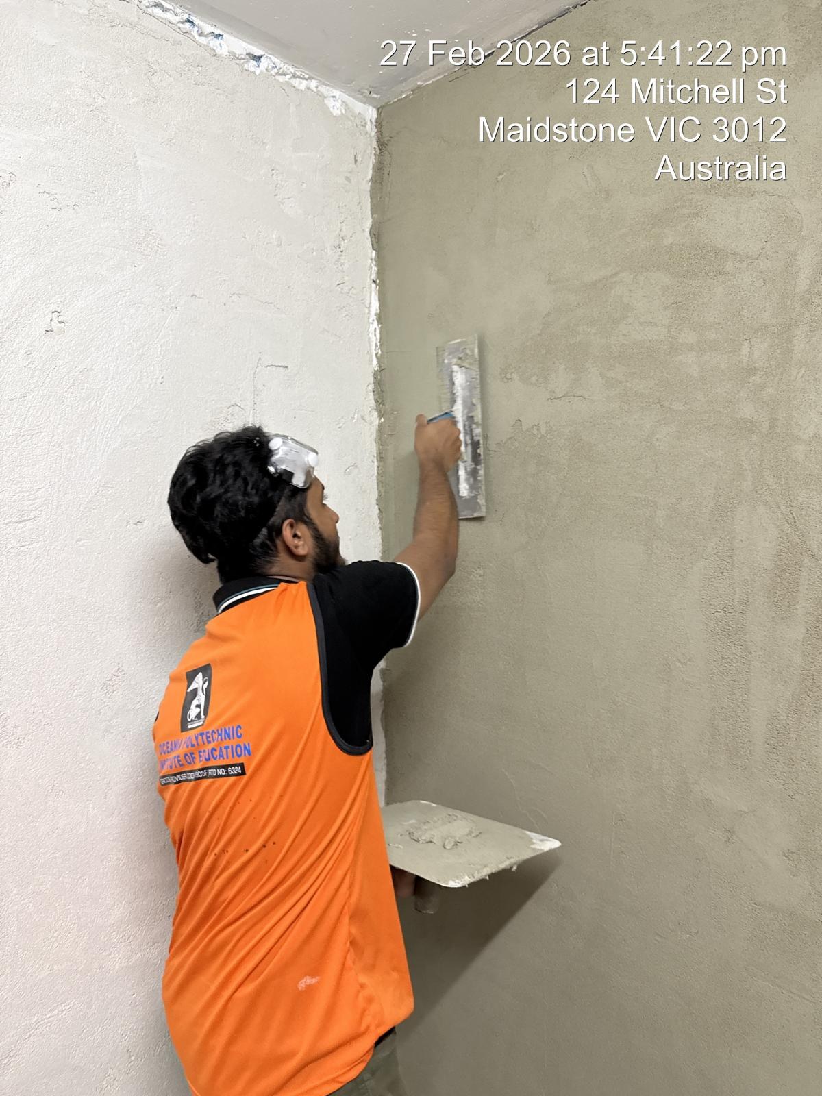 Applying plaster neatly into a room corner